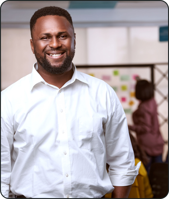 Nigerian man wearing white shirt smiling